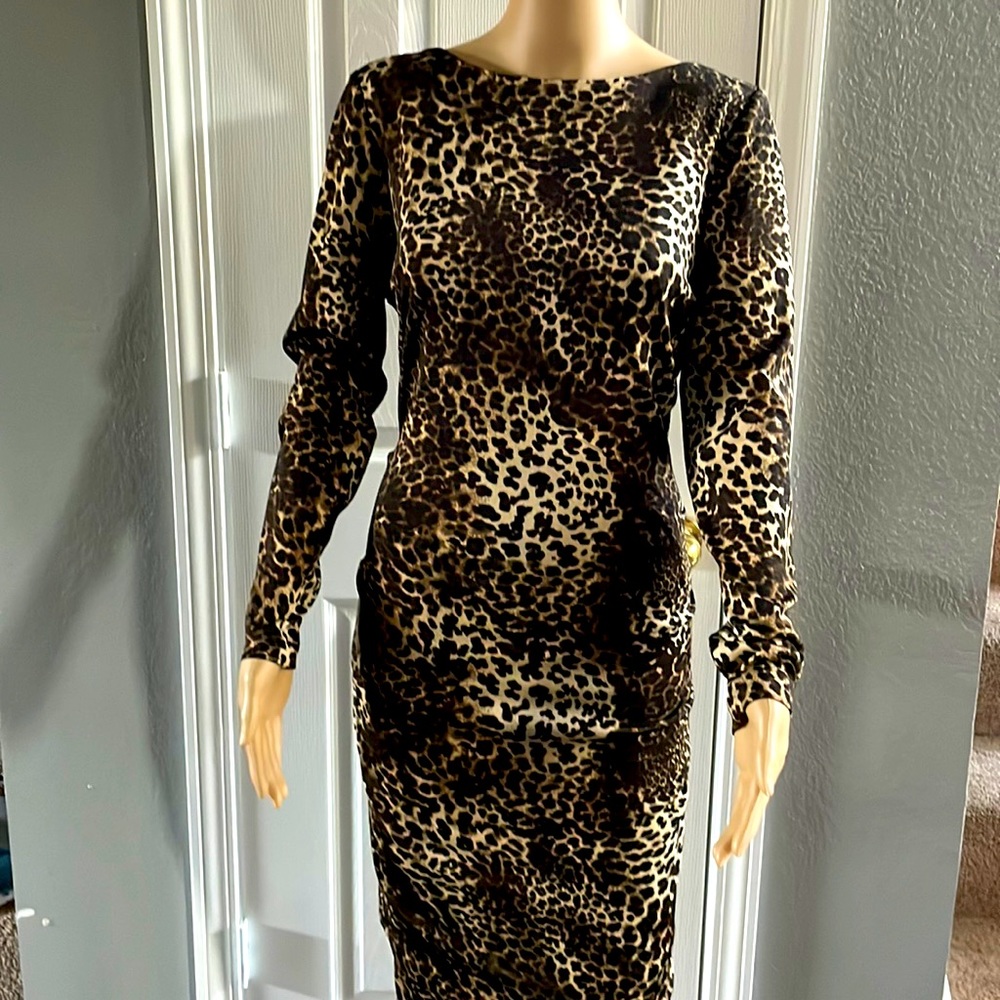 Leopard print pencil dress. Polyester stretch material. Has black lining.